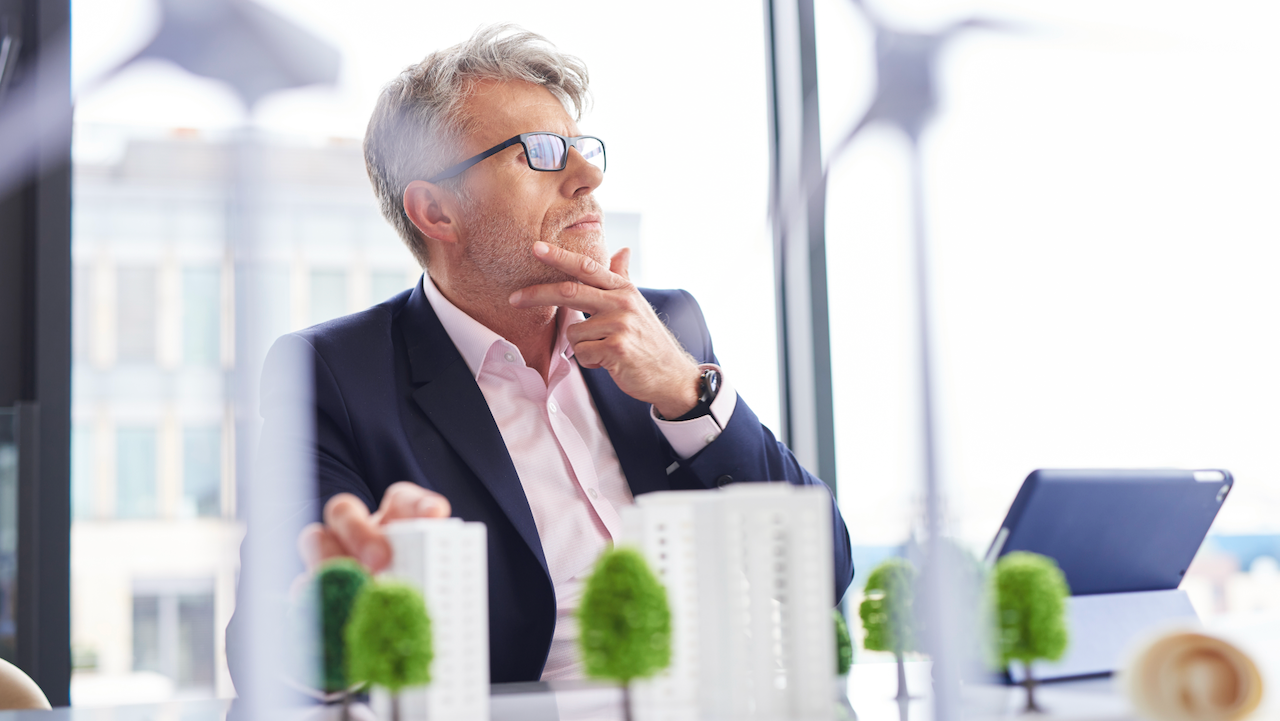 Busy businessman thinking about new solutions